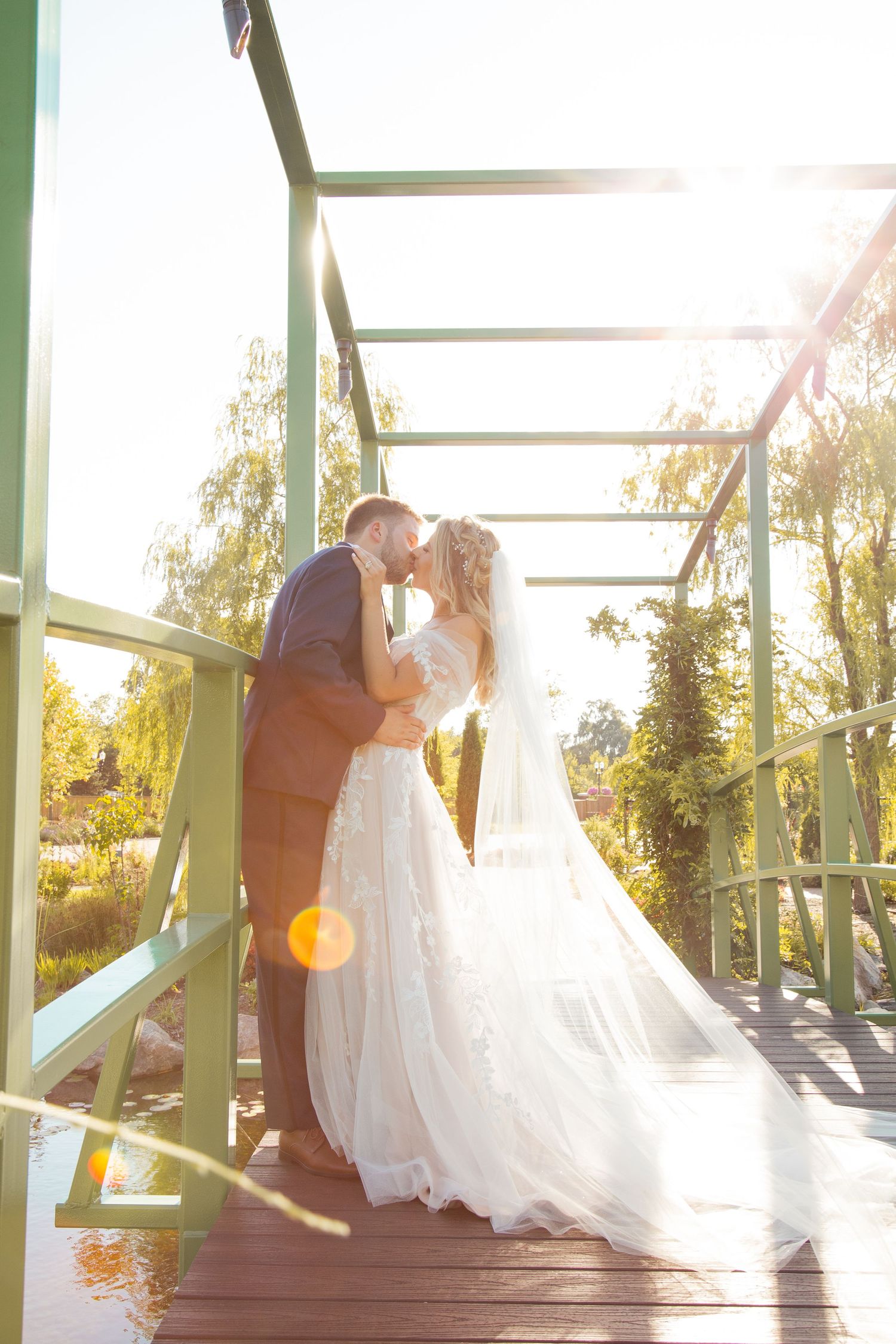 Beautiful wedding photoshoot on a wooden deck during golden sunset hour.