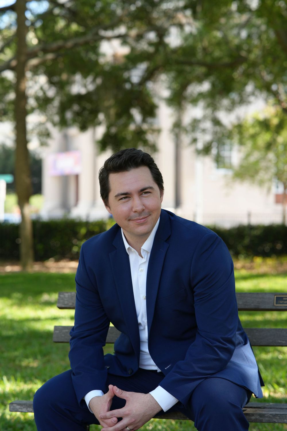 Branding headshot of businessman on bench in Tampa, FL.