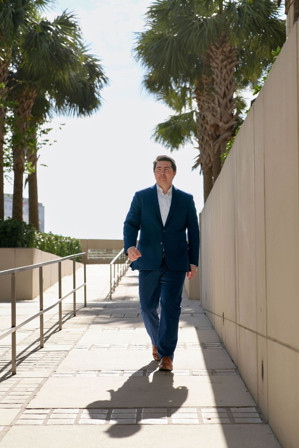 Branding photoshoot of businessman walking in downtown Tampa, FL.