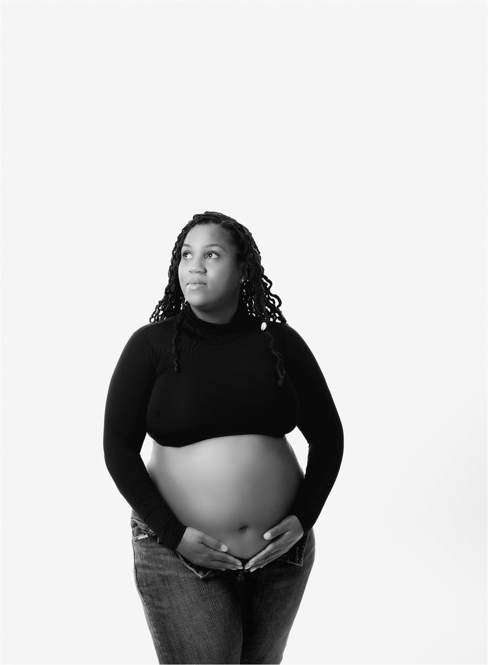 Austin Maternity Photographer Valerie Steinkoenig's photo omodern maternity portrait of black mom in jeans and black top