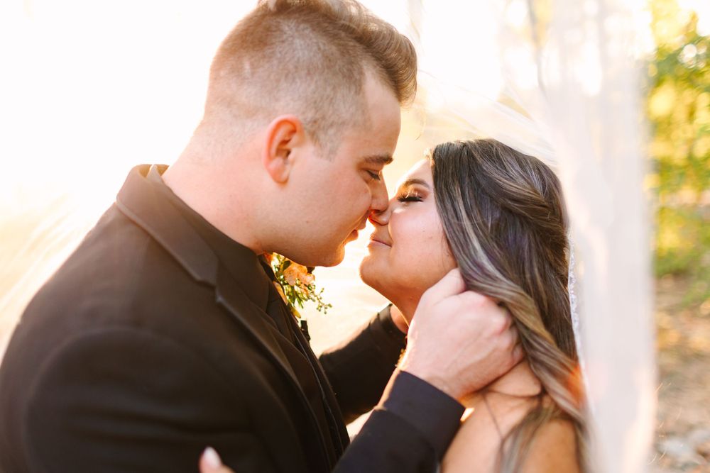 An intimate moment between newlyweds captured during golden hour.