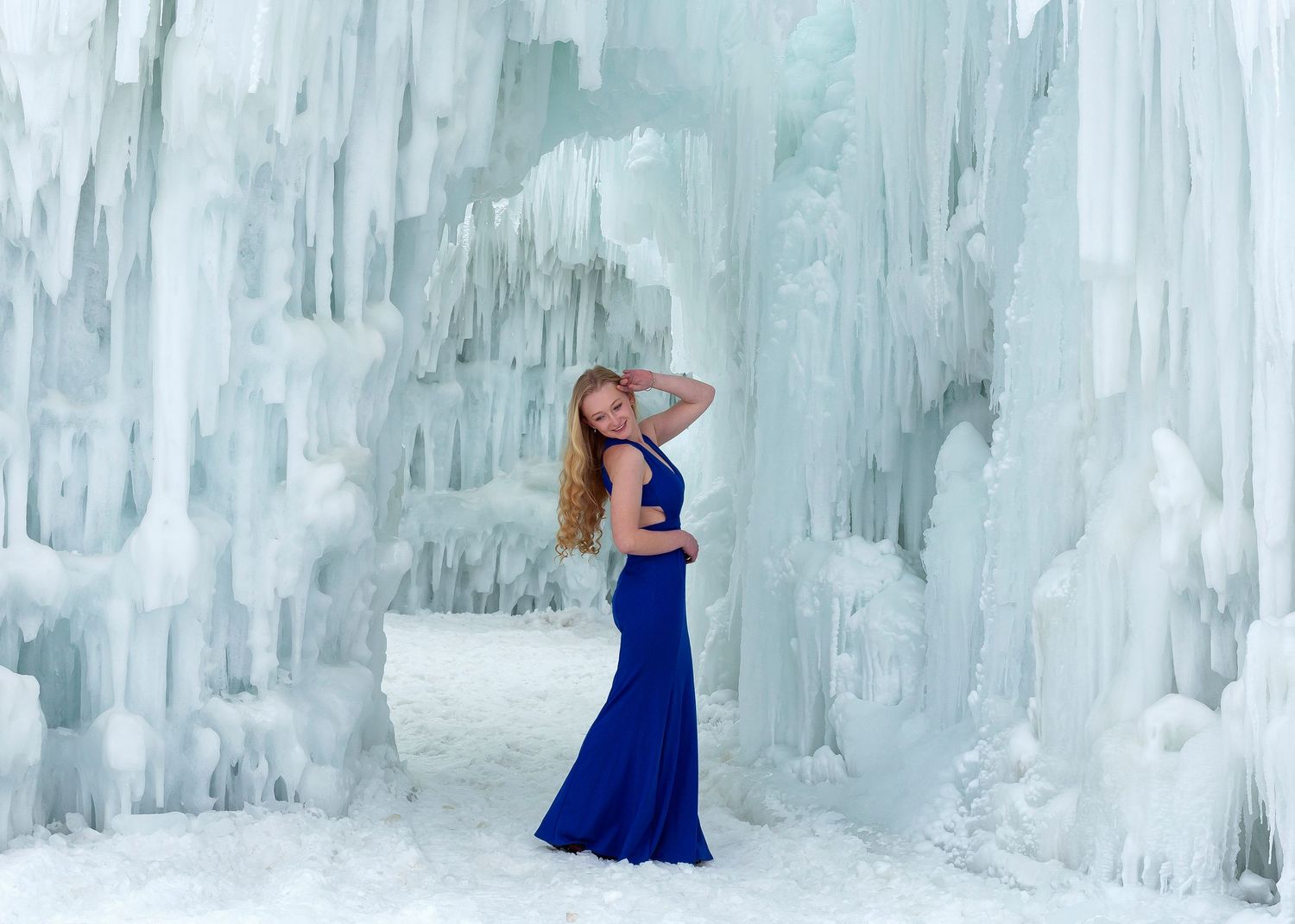 Midway Ice Castle Senior Styled Photoshoot with senior in blue fitted prom dress