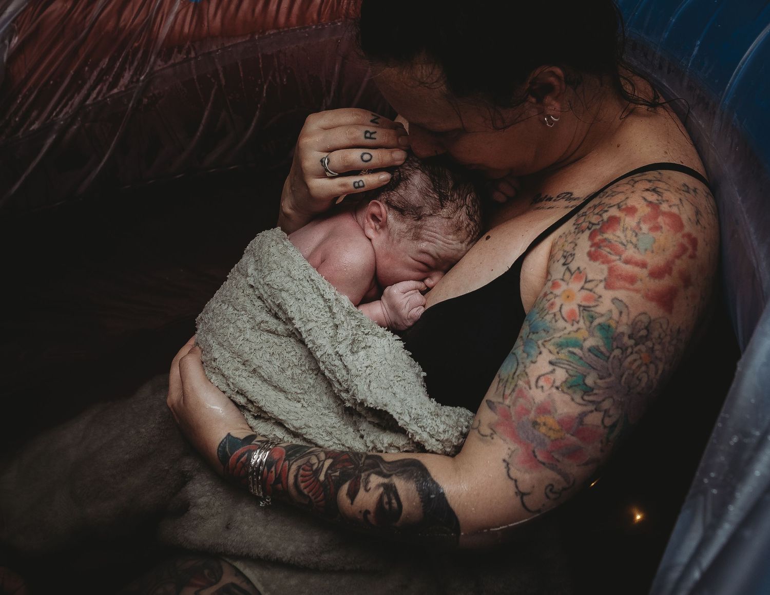 Intimate couple photography with moody lighting and artistic composition.