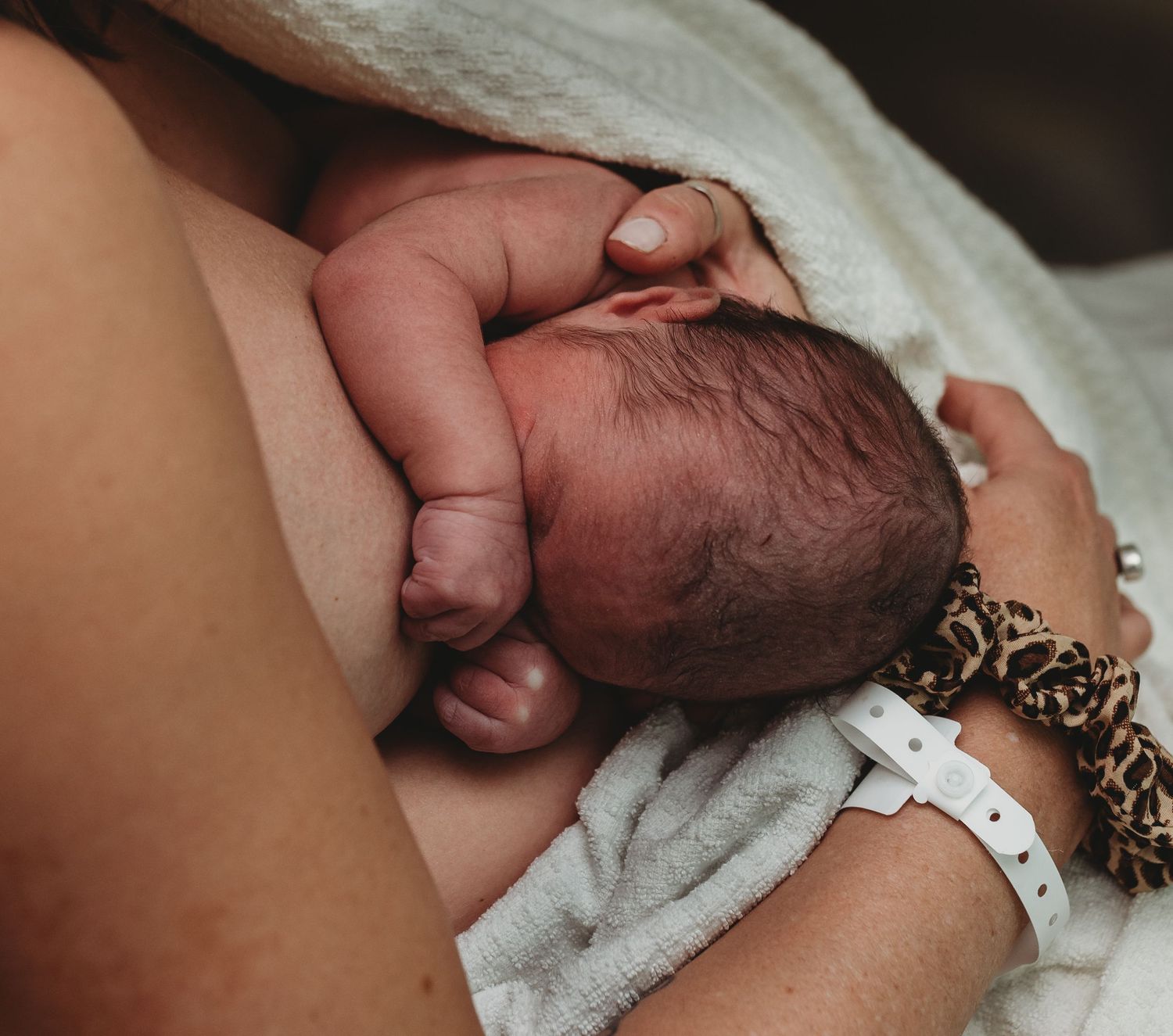 Healthcare provider conducting thorough newborn medical screening.