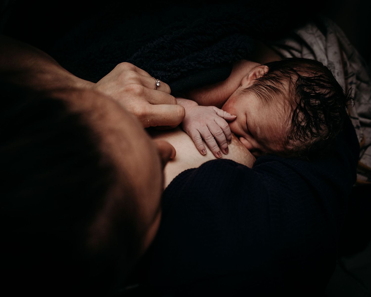 Dramatic black and white images showing gentle embraces and intimate moments.