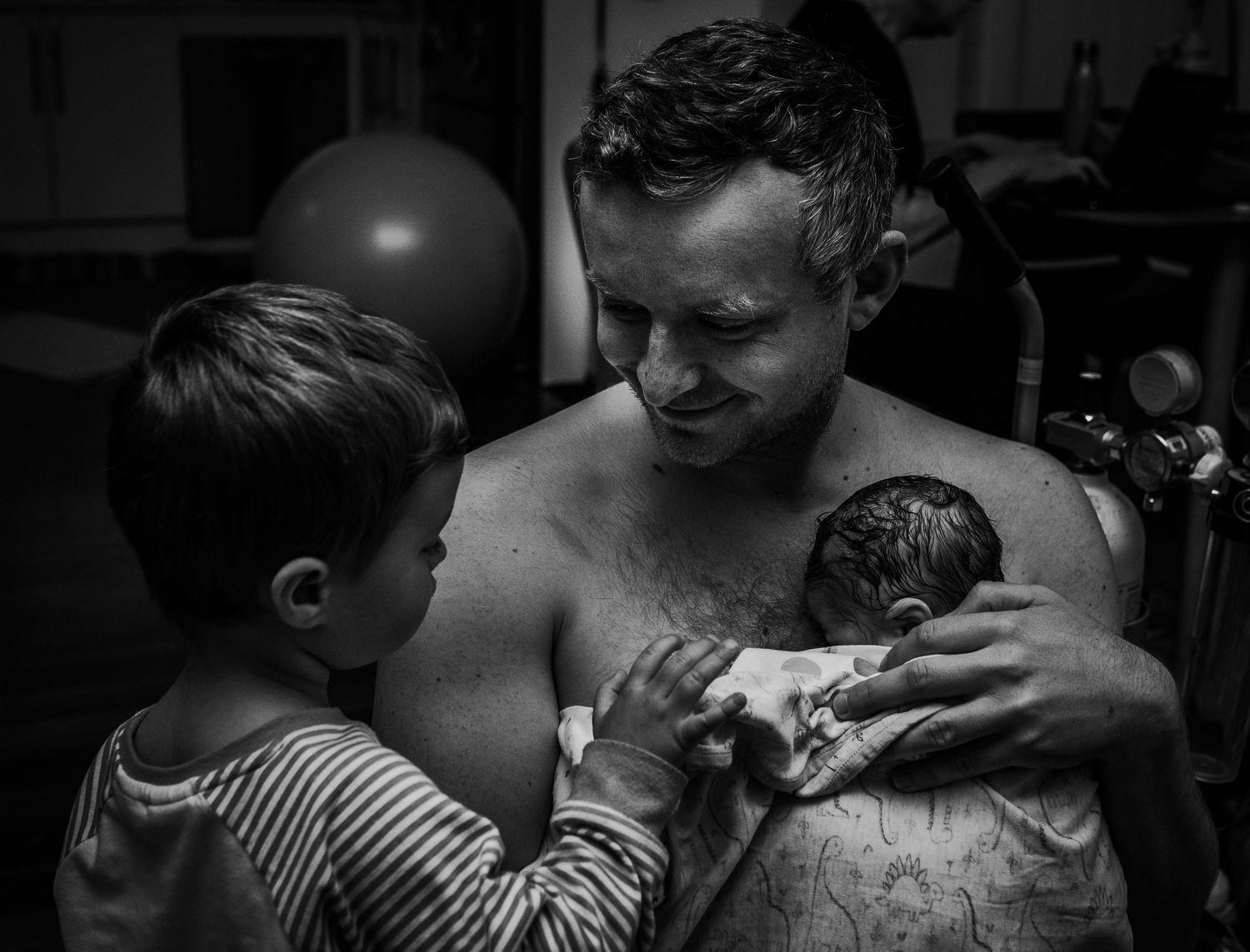 Series of intimate black and white photographs showing close physical connection and bonding.