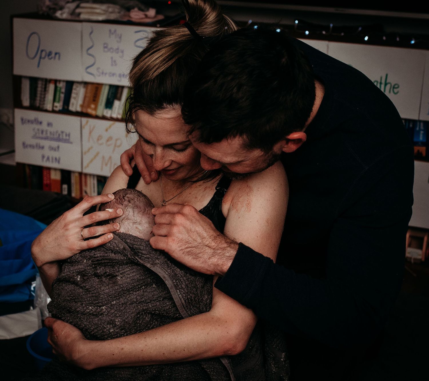 Dark moody images showing emotional support during medical care.