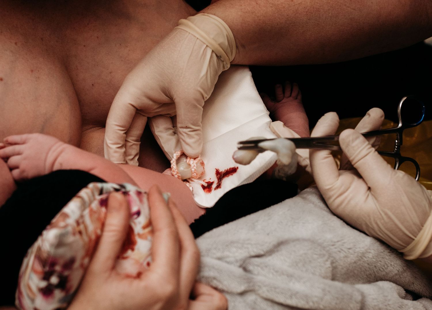 Medical professional performing newborn health examination.