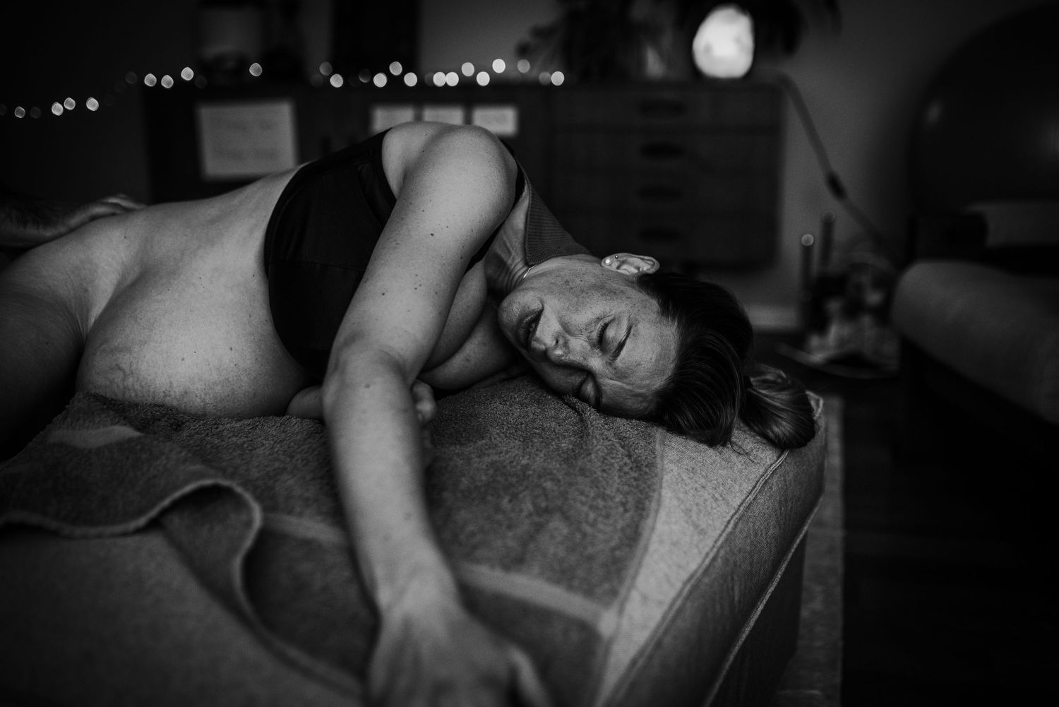 Intimate black and white boudoir photography series showing artistic poses and shadows.