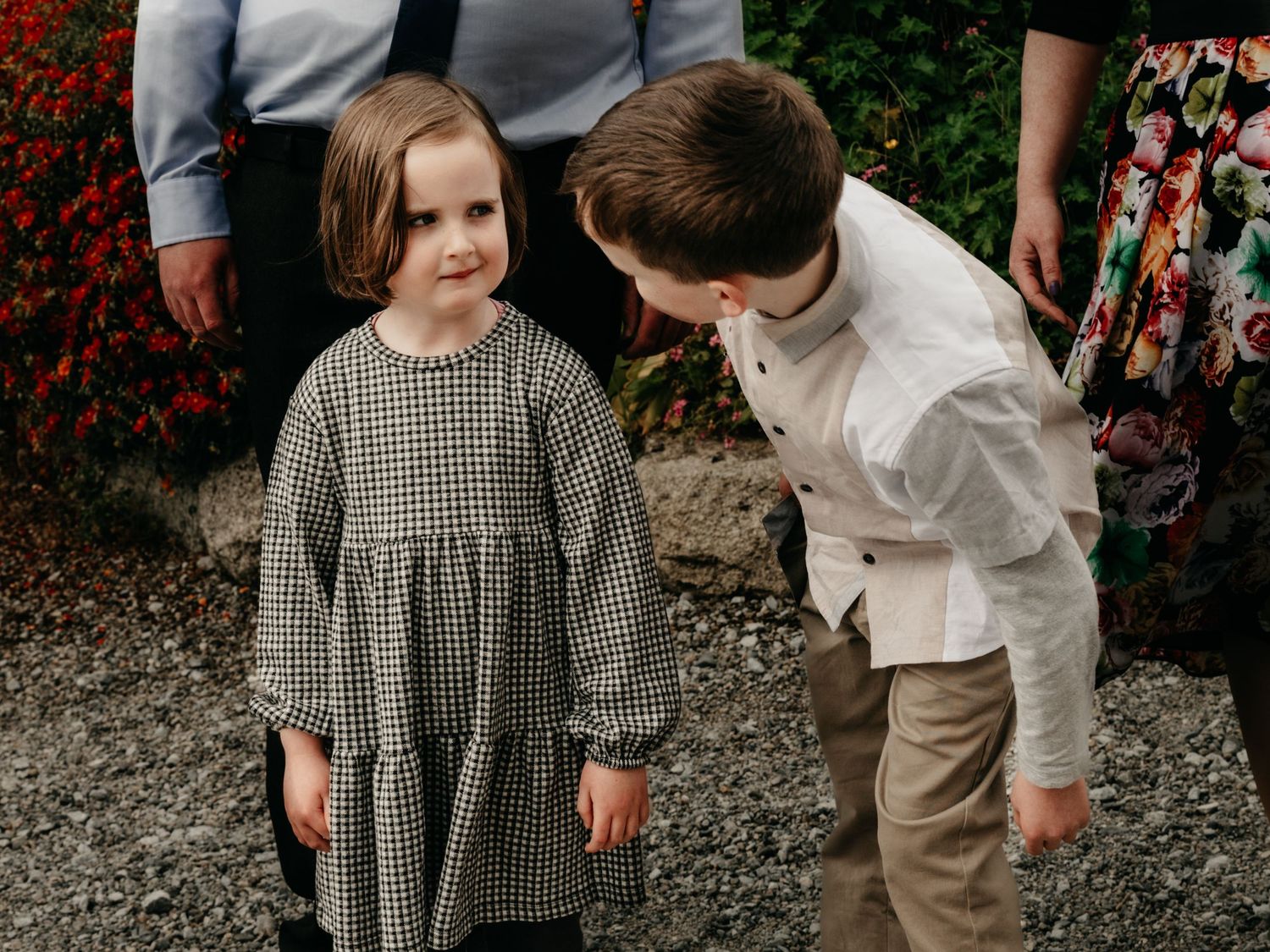 siblings playing at communion