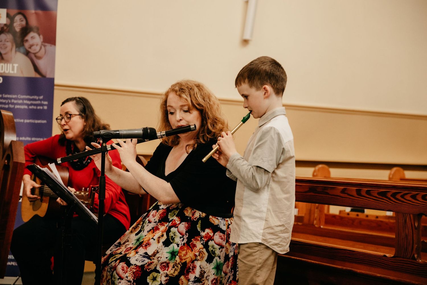 Mother and son perform music at communion