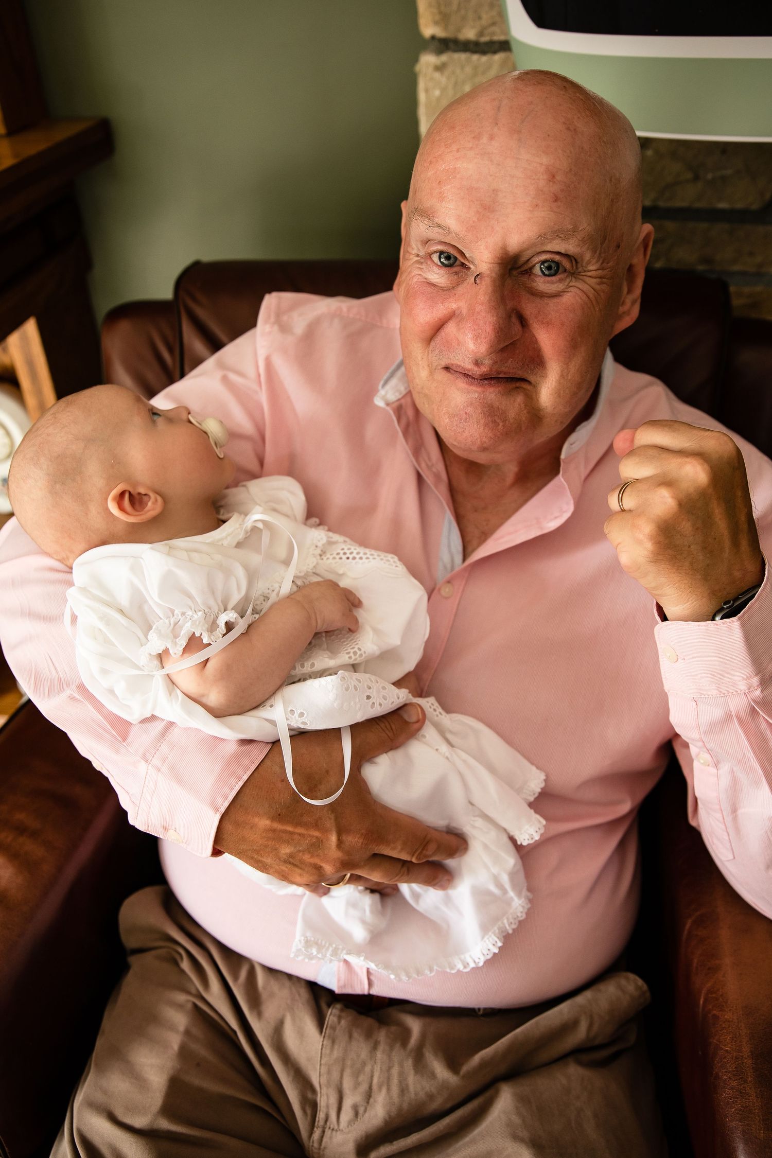 Grandfather holding grandson