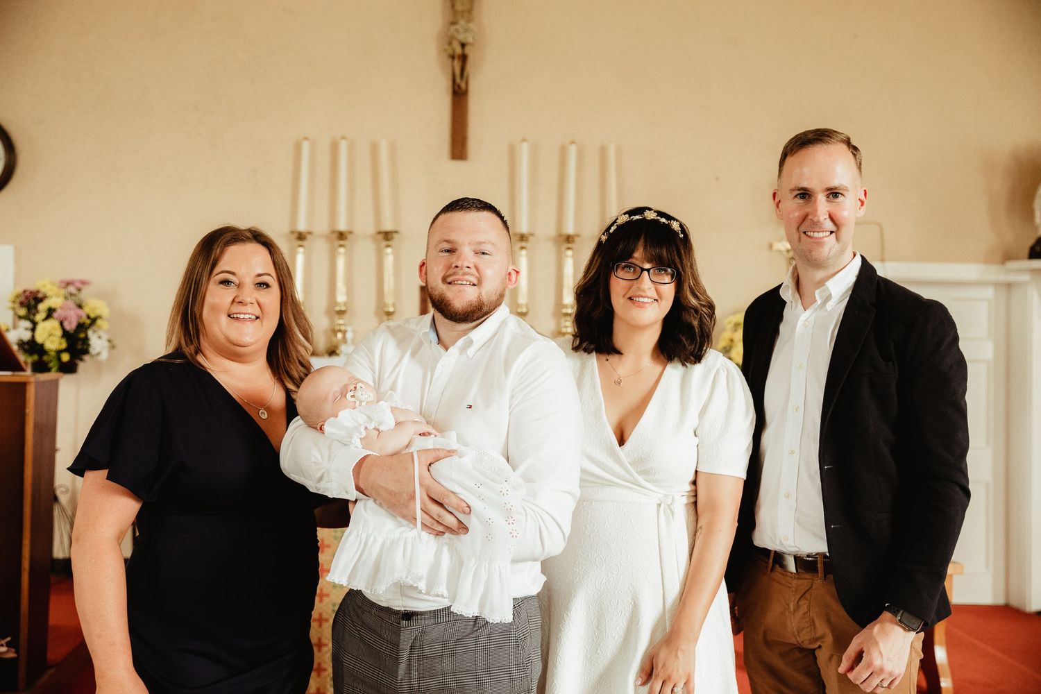Parents, Godparents and Child on alter at baptism