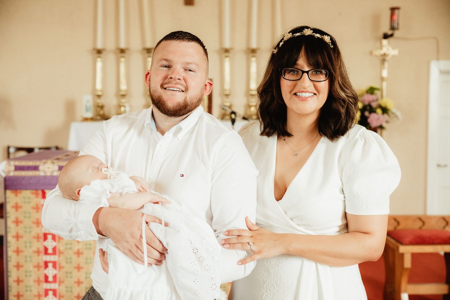 Parents and child at baptism