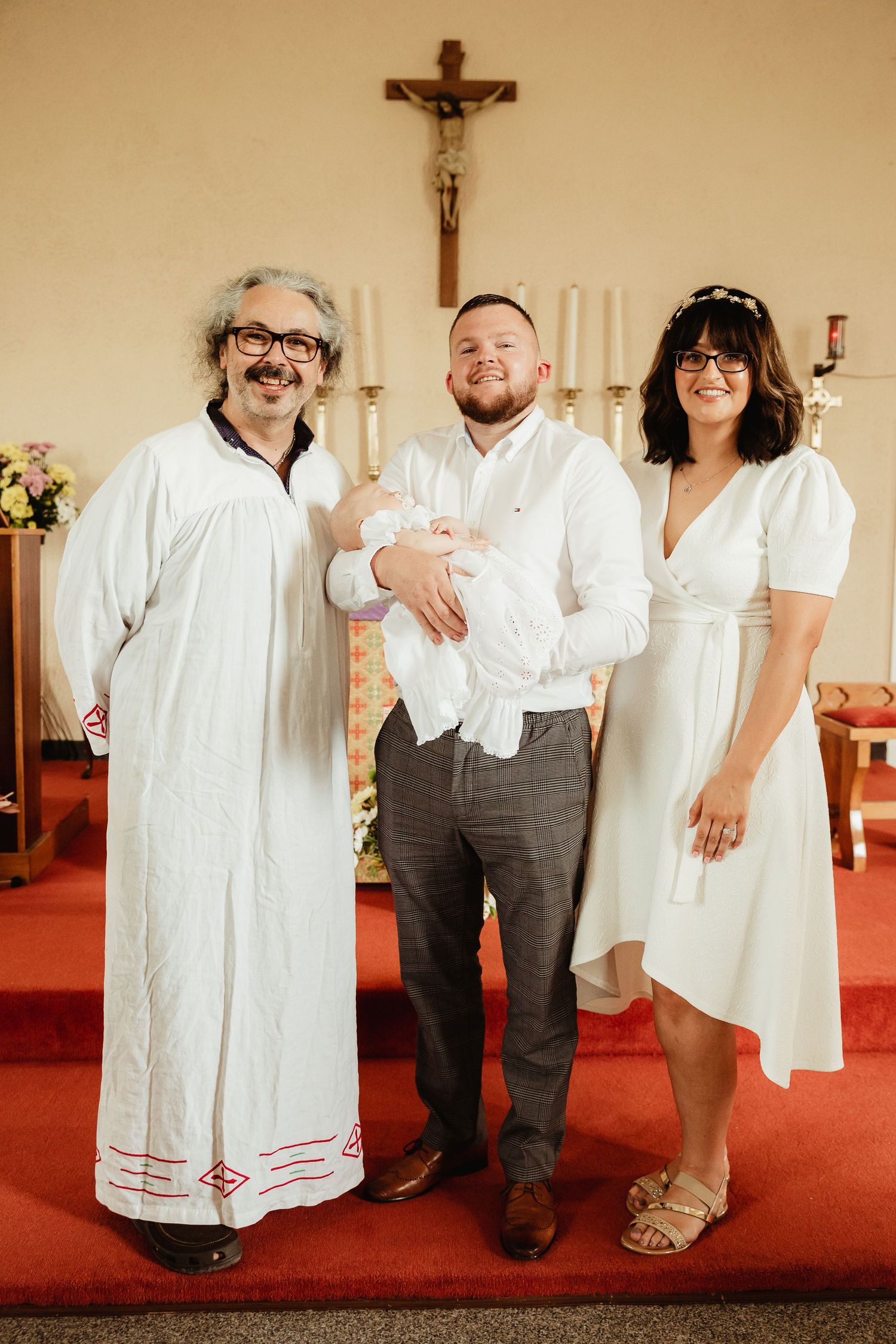 Parents, child and priest and baptism