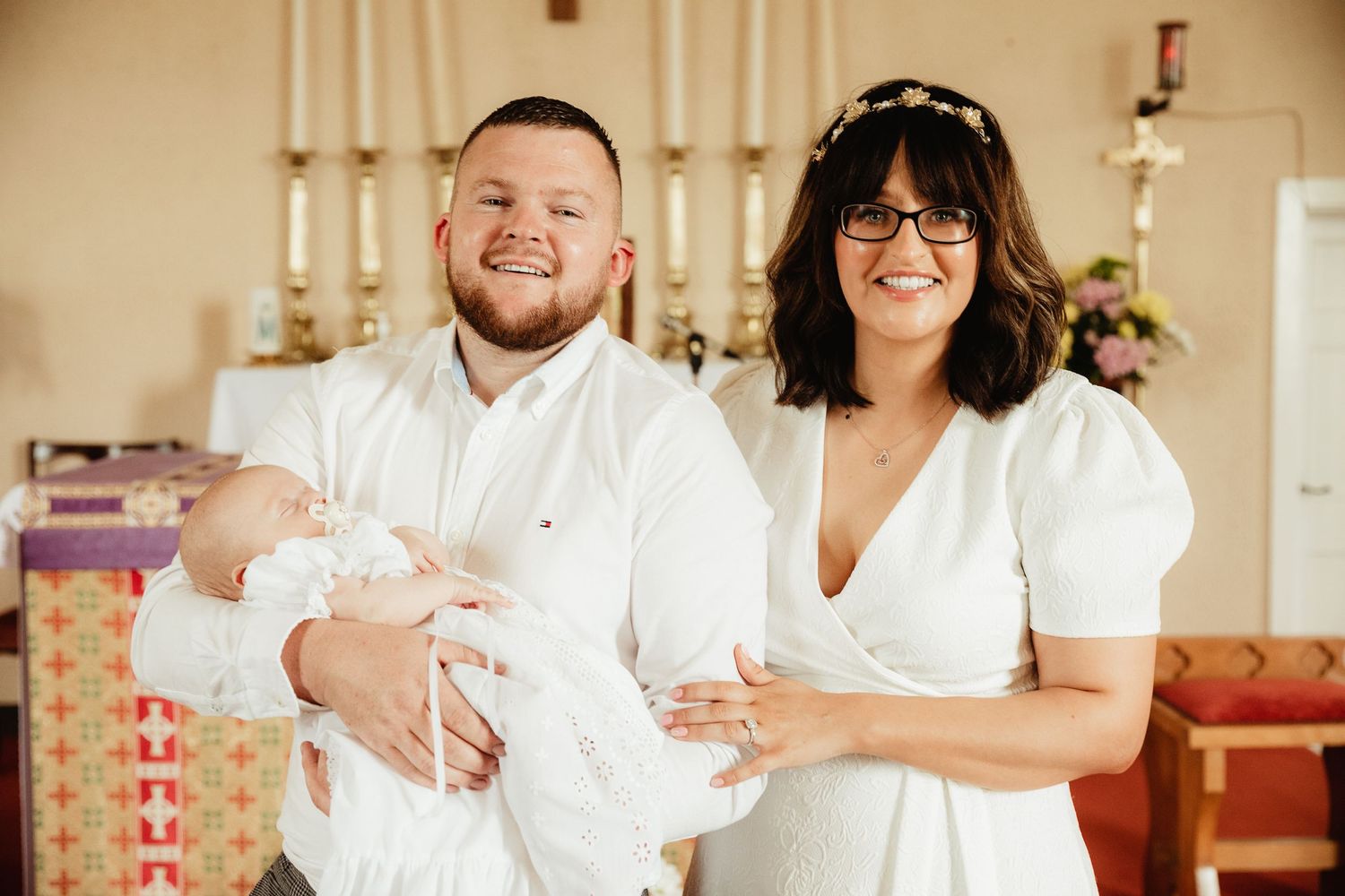 Parents and child at baptism