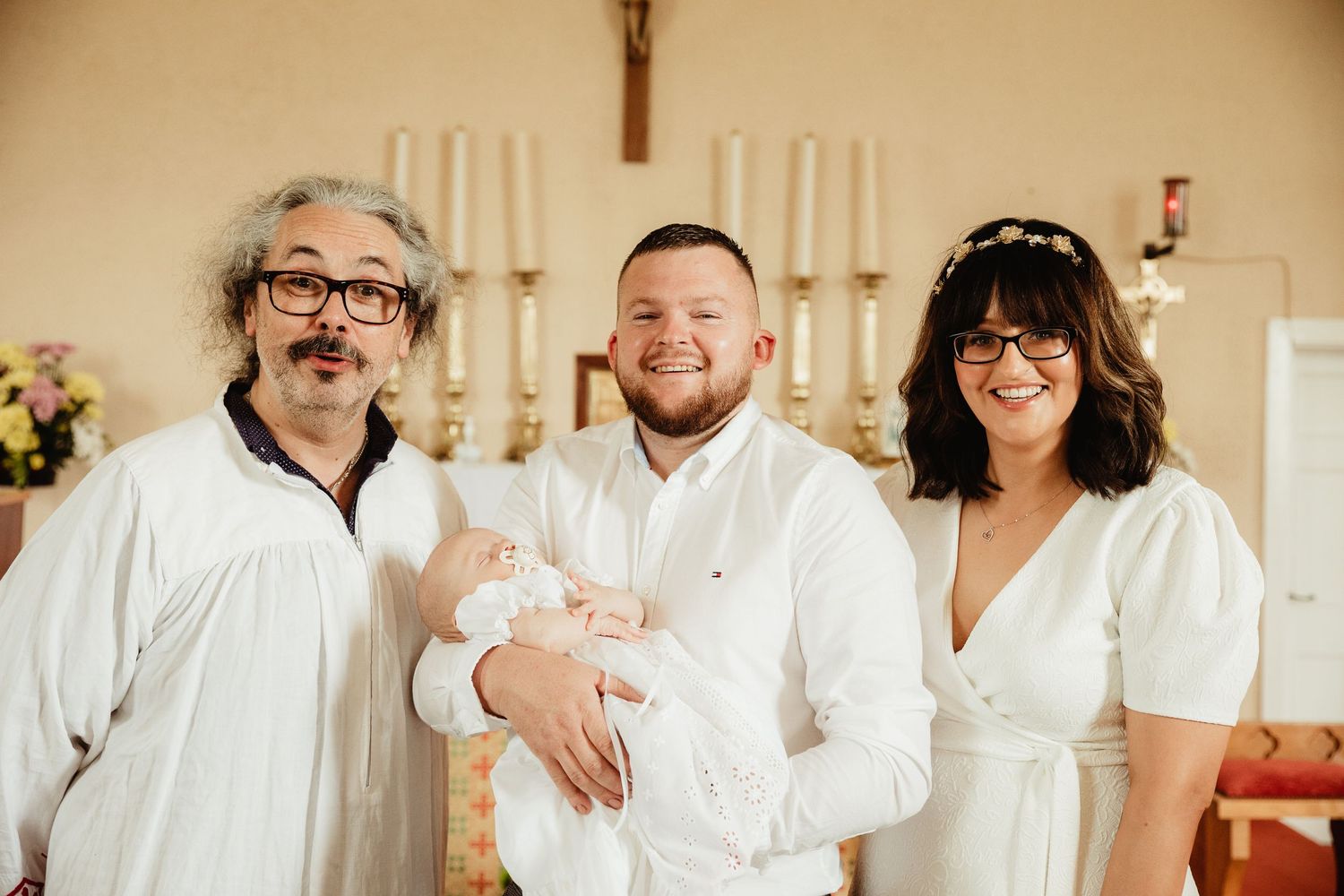 Parents, child and priest and baptism