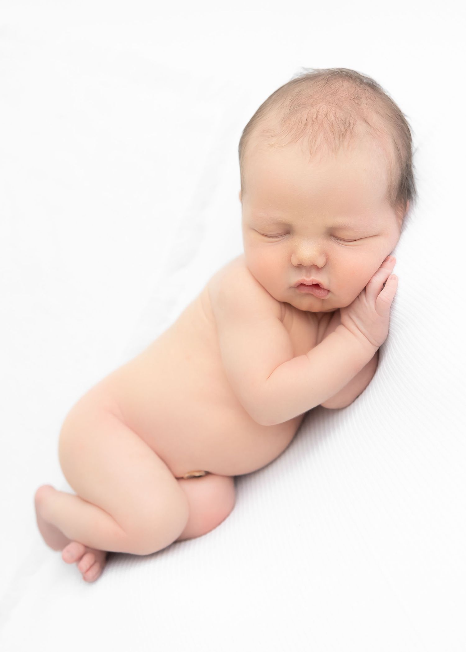 newborn baby boy sleeping on a white blanket, baby photography near me in sarasota, port charlotte, florida