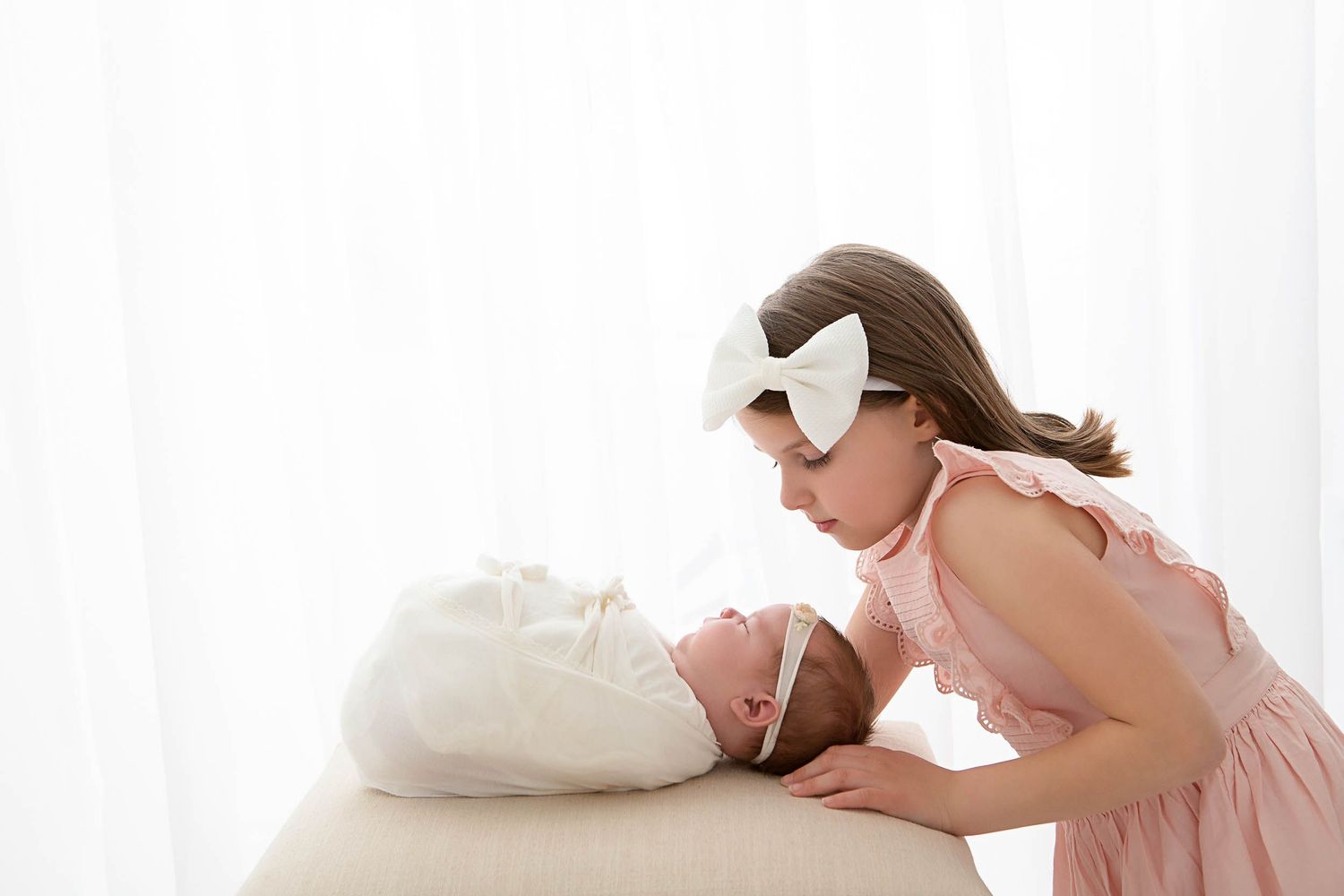 newborn baby with older sister in pink dress, sarasota infant photographer, baby photography, birth and maternity