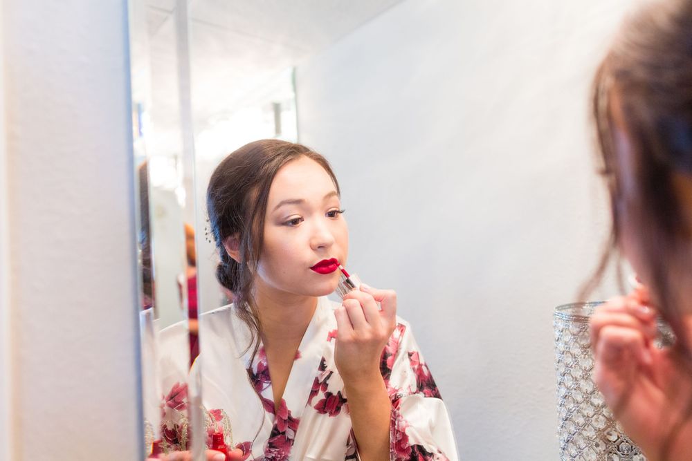 Final makeup touches being applied in preparation for a special event.