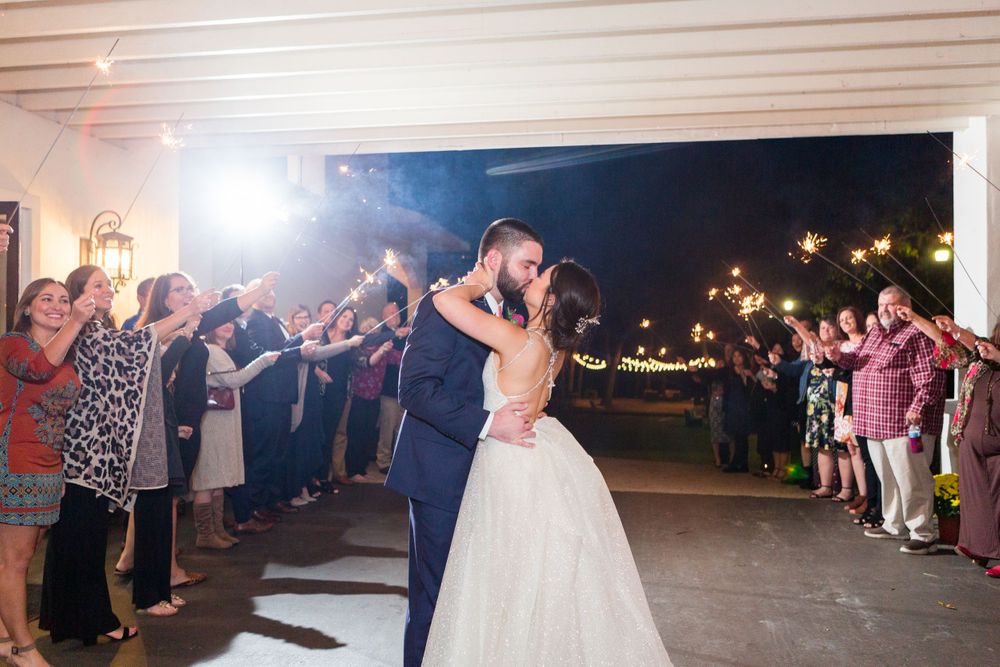 A romantic first dance moment at an outdoor nighttime wedding reception.