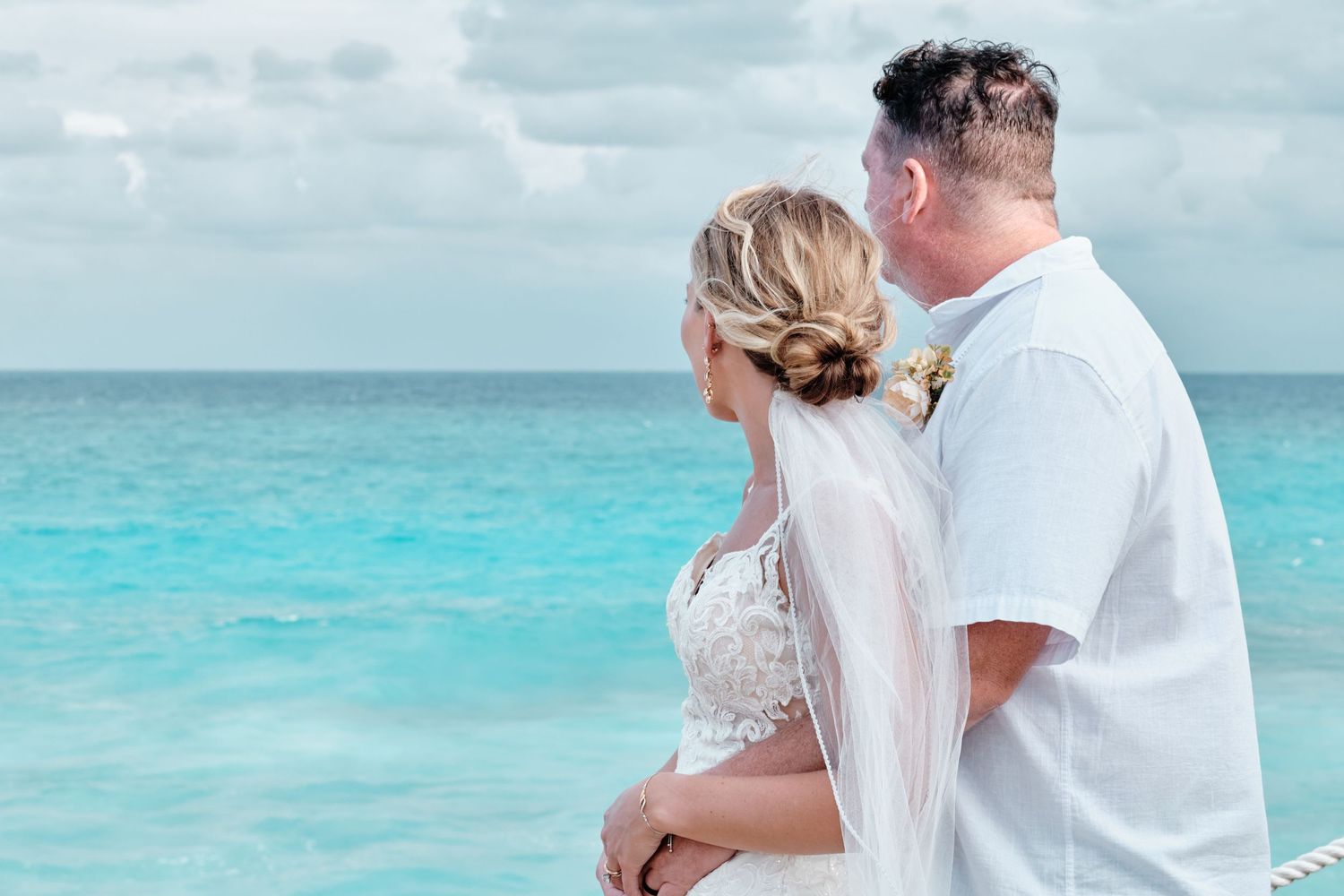 Happy couple looking out over the water - Green Bay, Wisconsin Wedding Photography.