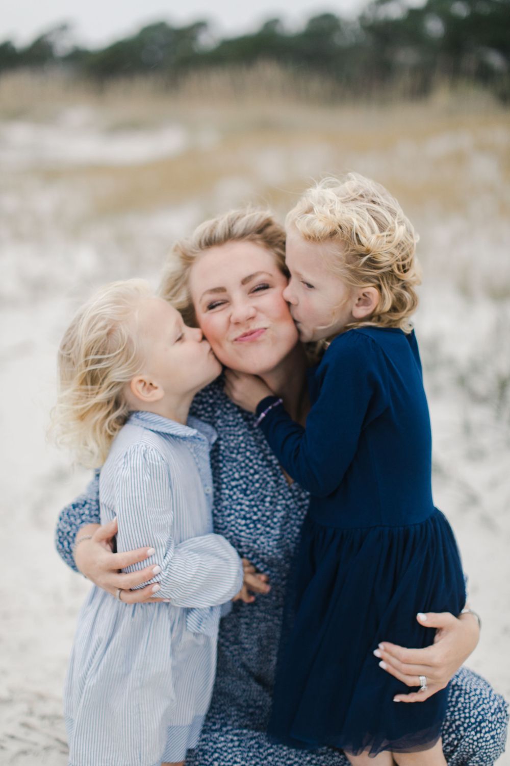 Sweet family moment captured in a photograph on a sandy beach in Hilton Head, South Carolina at Sea Pines Plantation.