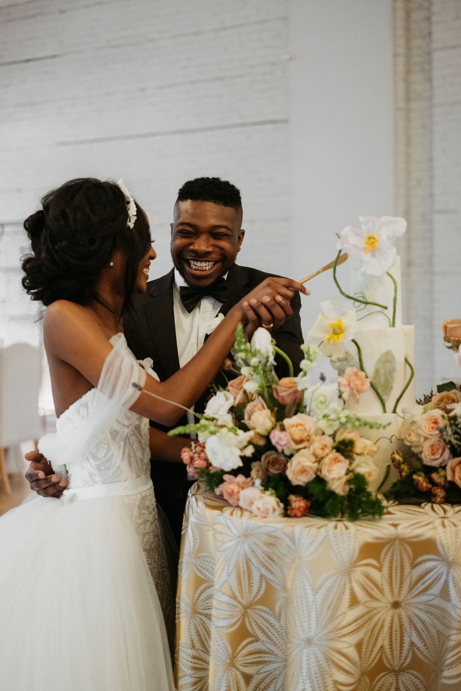 Elegant wedding reception featuring beautiful floral arrangements and joyful celebration.
