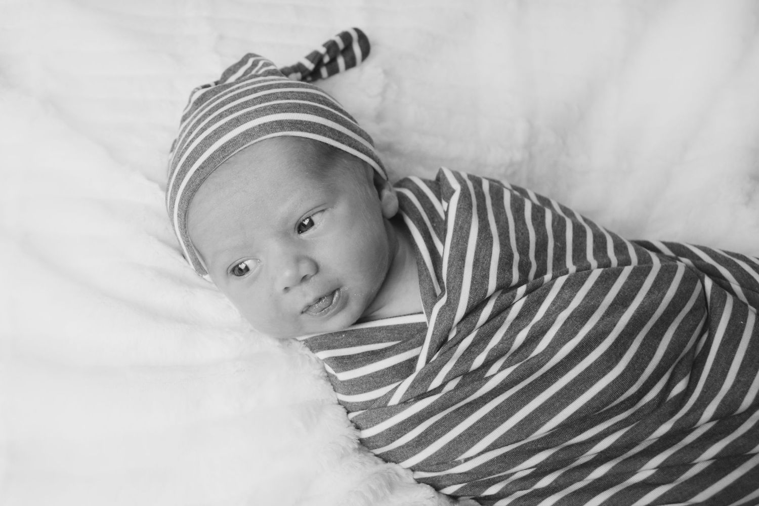 newborn sessions, Cairo, ga white blanket, stripped swaddle