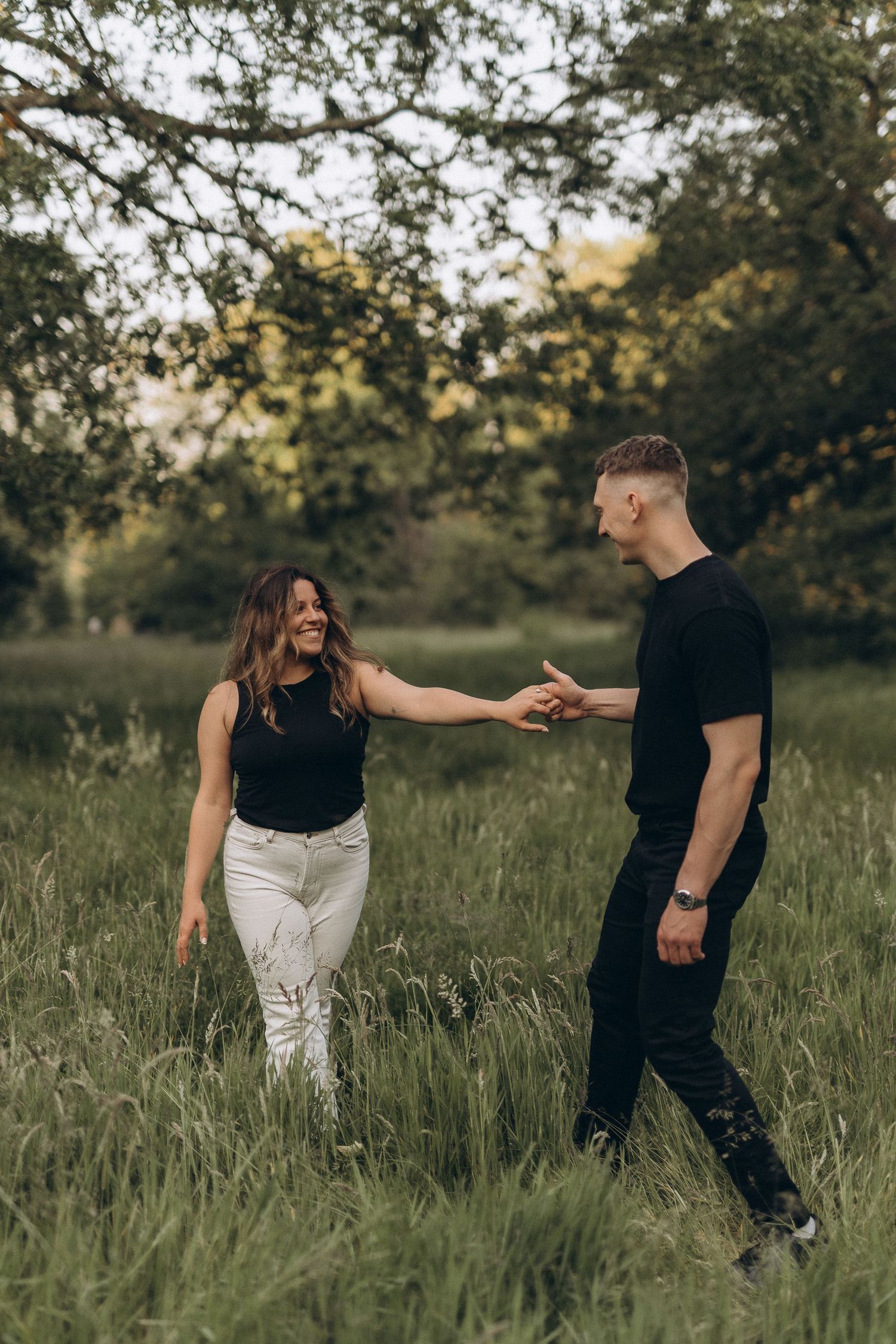 Couple is holding hands during their engagement photoshoot in London