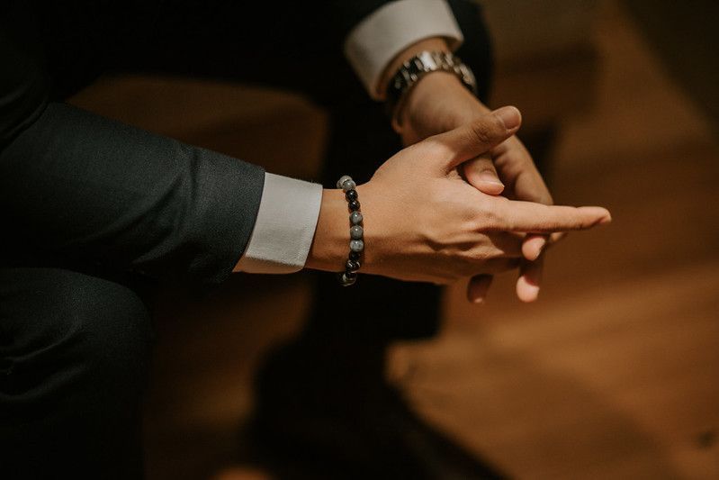 Series of hand gestures captured in dramatic low-key lighting.