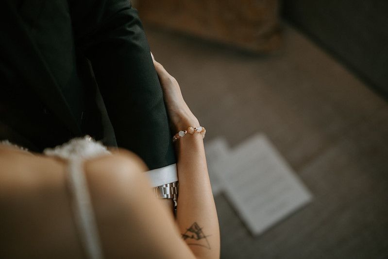 Artistic close-up shot of couple sharing intimate moment indoors.