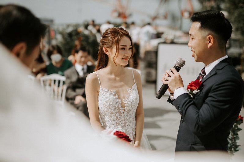 Intimate wedding ceremony moments captured on a rooftop venue with elegant decor and floral details.