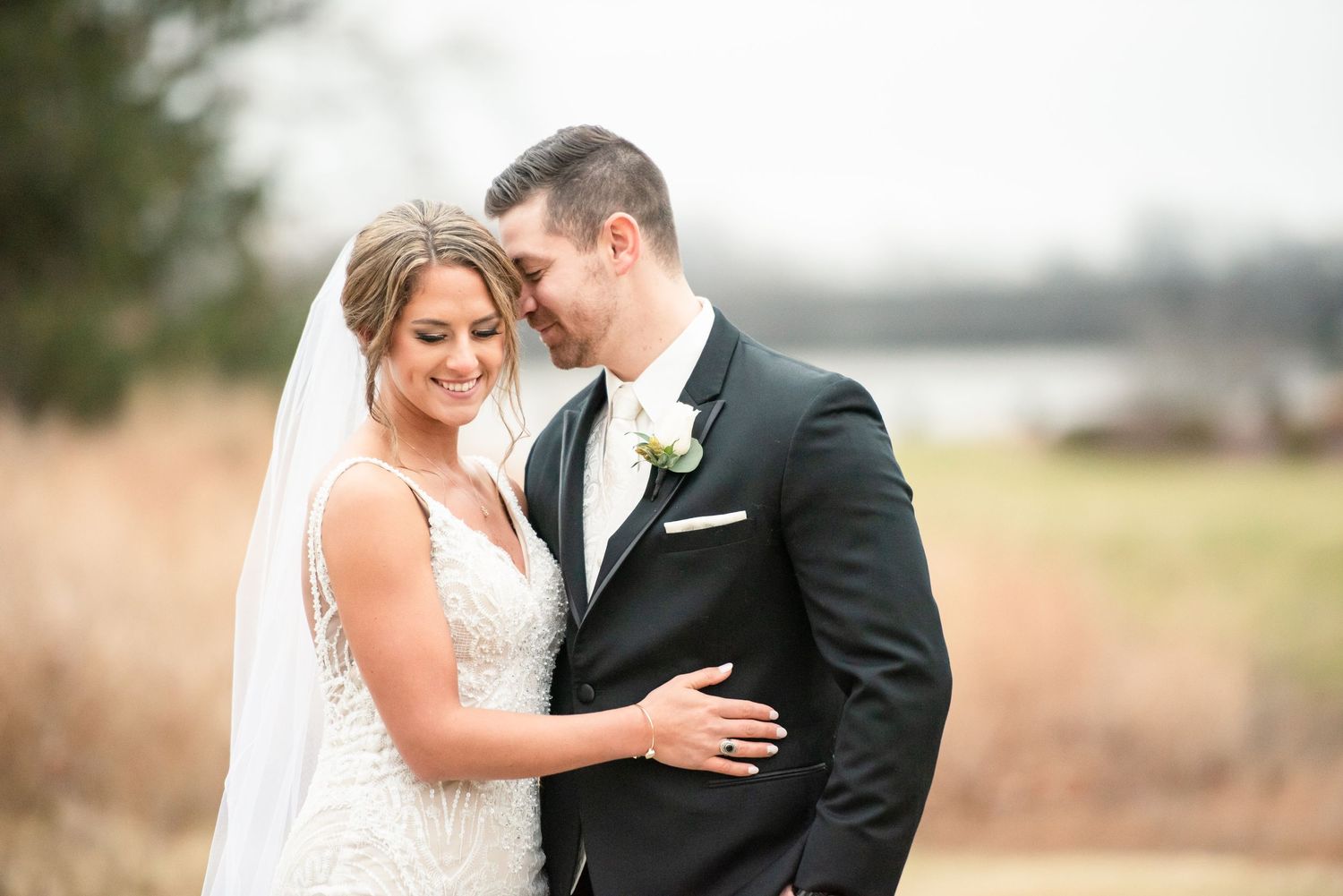 Bride and Groom Snuggle and Smile  - Close Up - Golf Course Photos - Winter Wedding - Lynn Monaco Photography - NJ