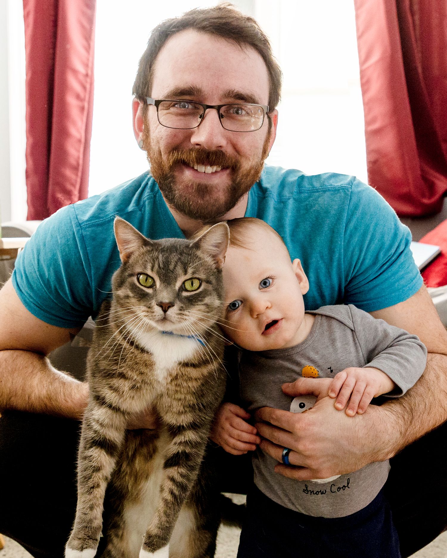 Family Photographer Boston Massachusetts dad and son with cat happy