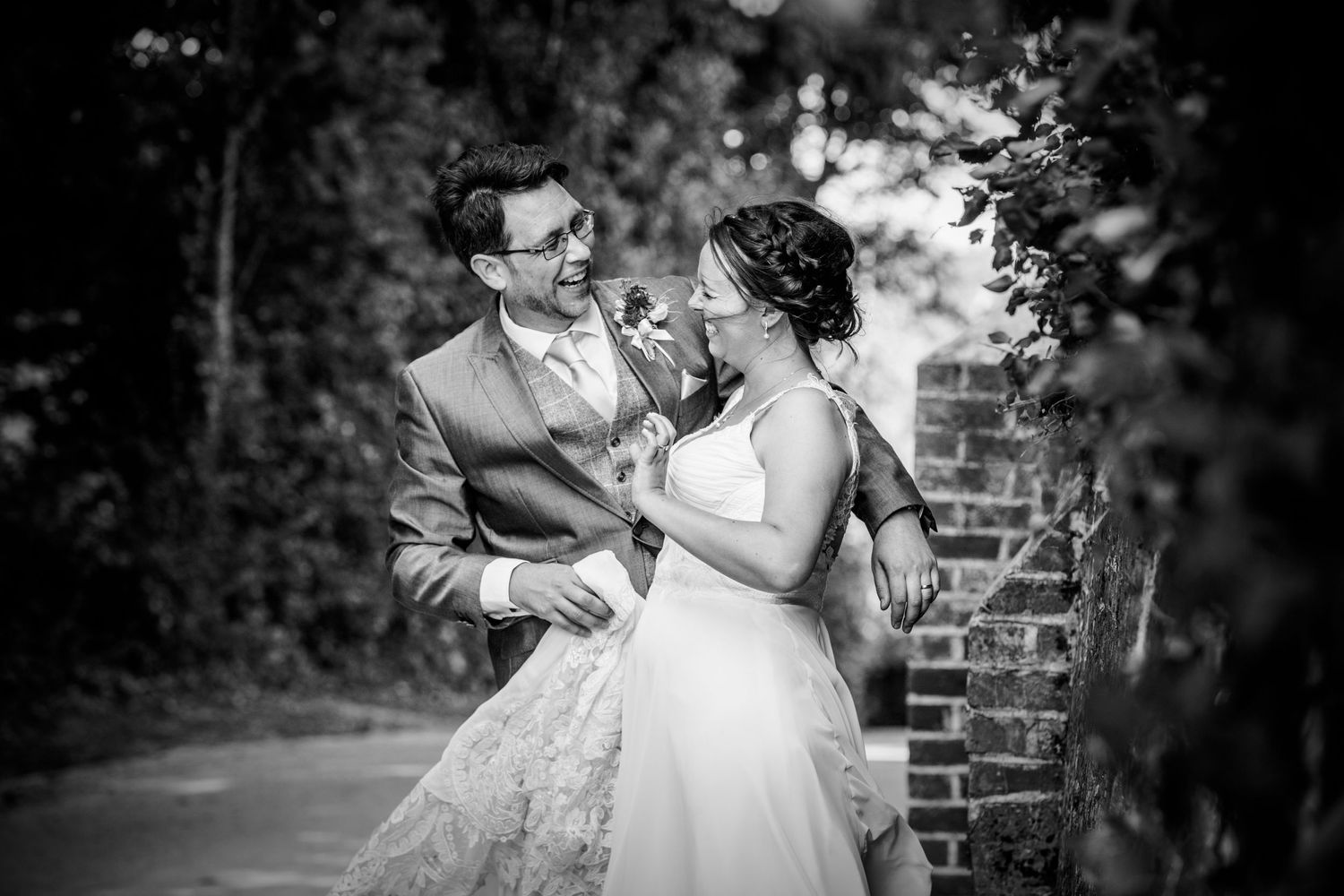Black and white romantic portraits captured in a garden setting.