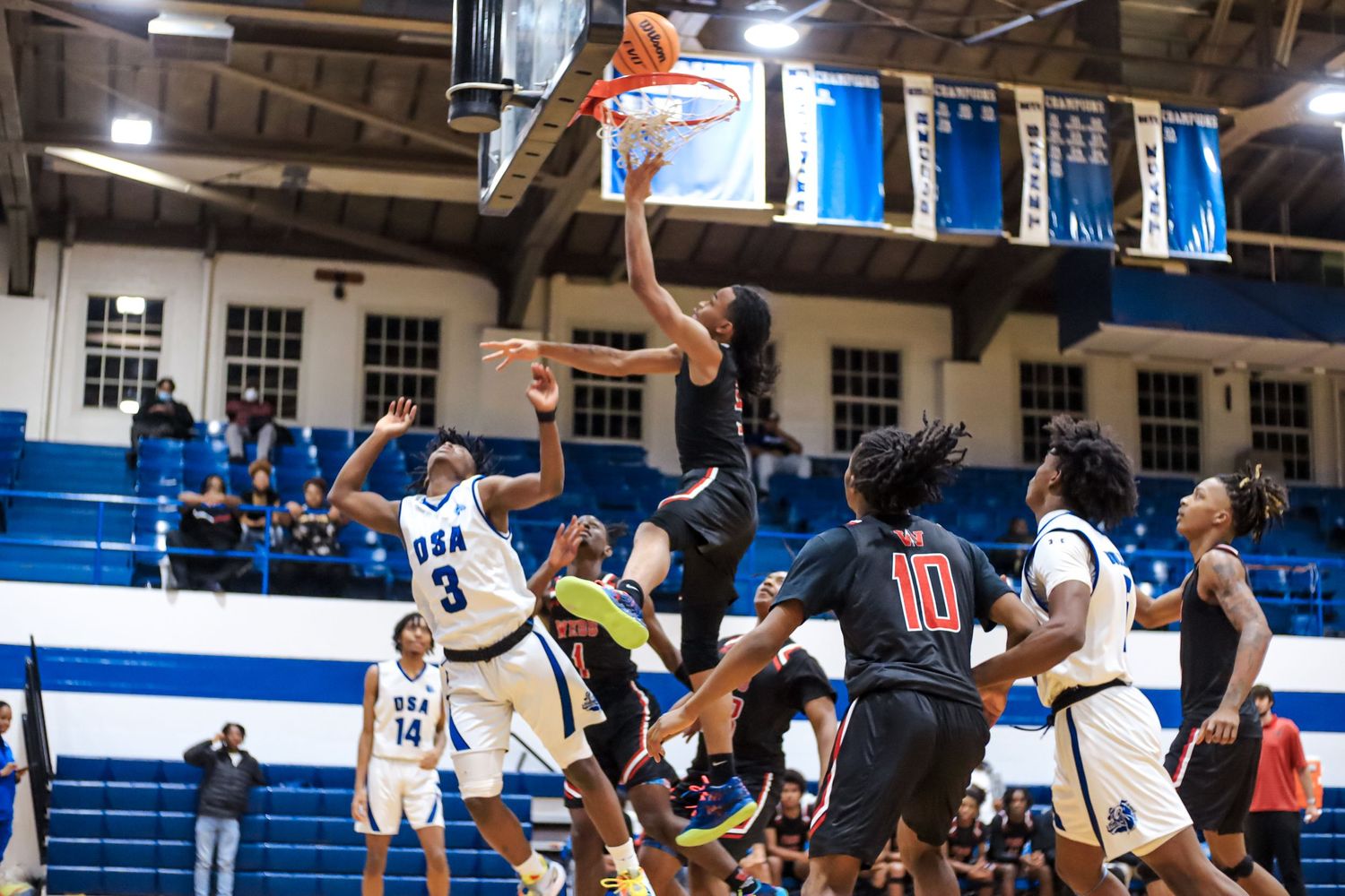 High school boy shooting basketball