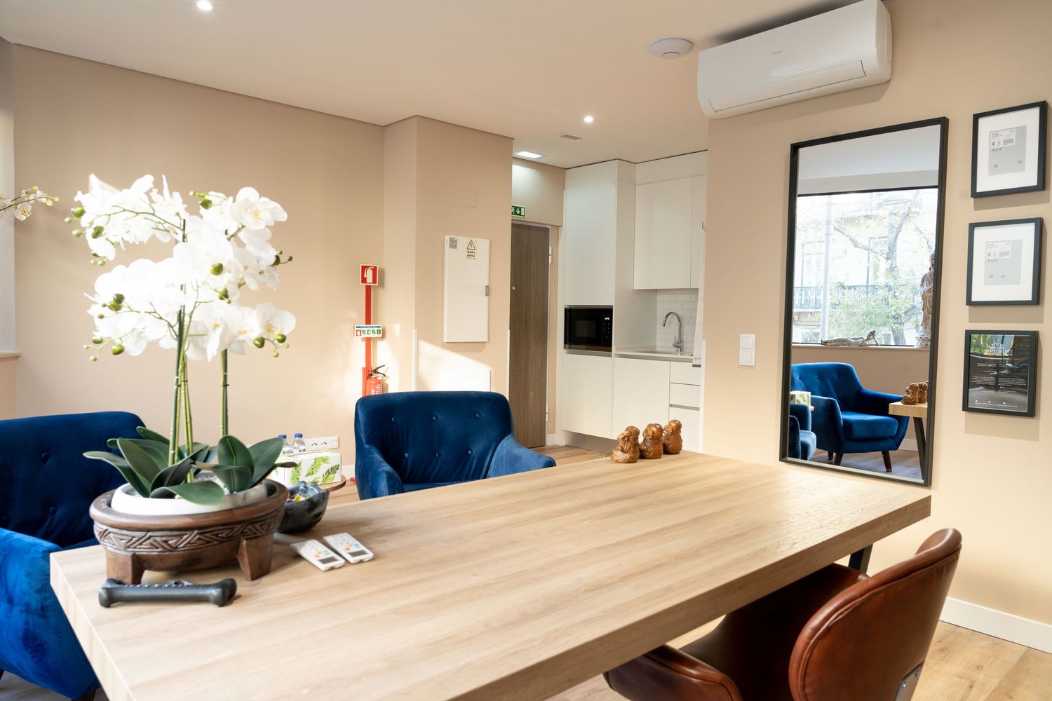 Elegant spa treatment room with warm lighting, wooden accents, and professional equipment.