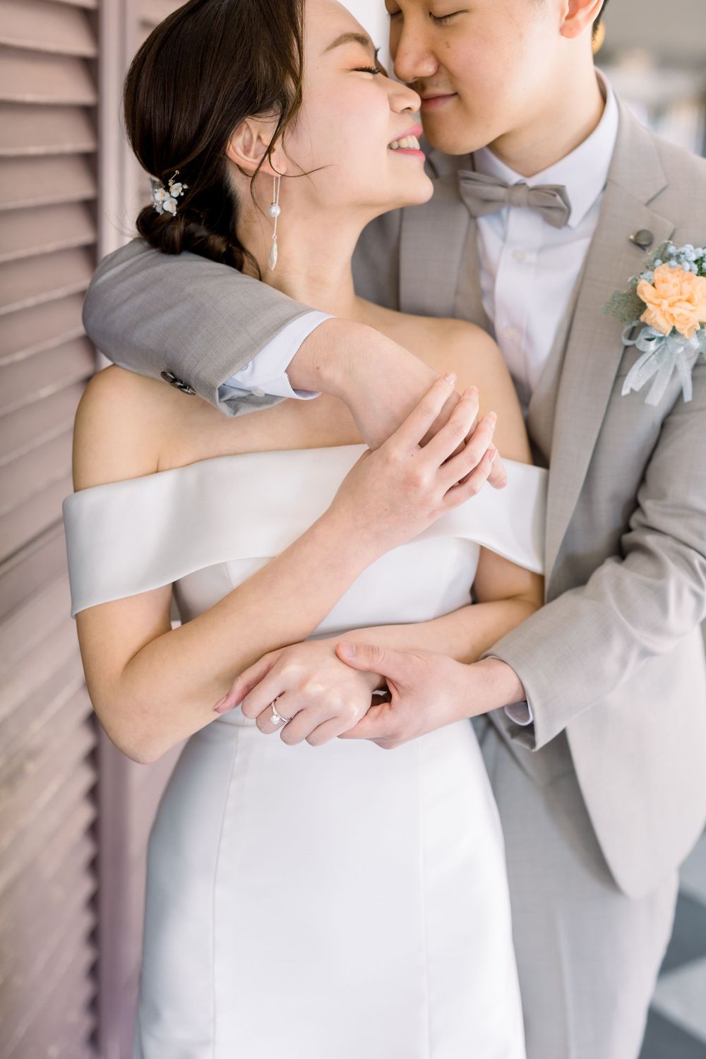 Close-up wedding portraits showing tender moments between newlyweds in formal attire.
