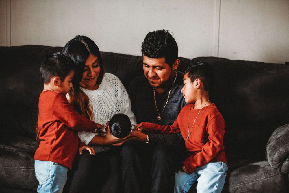 Family bonding moments captured in cozy indoor setting.