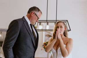 Father of the bride and bride before leaving for the wedding ceremony
