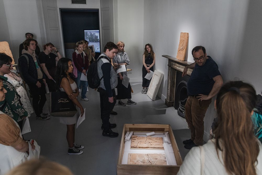 photo of a Galway international arts festival volunteers meeting with an artist at the arts centre in Galway