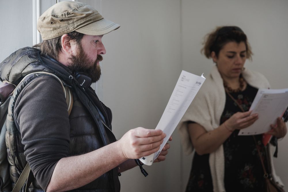 photo of a Galway international arts festival volunteers meeting with an artist at the arts centre in Galway