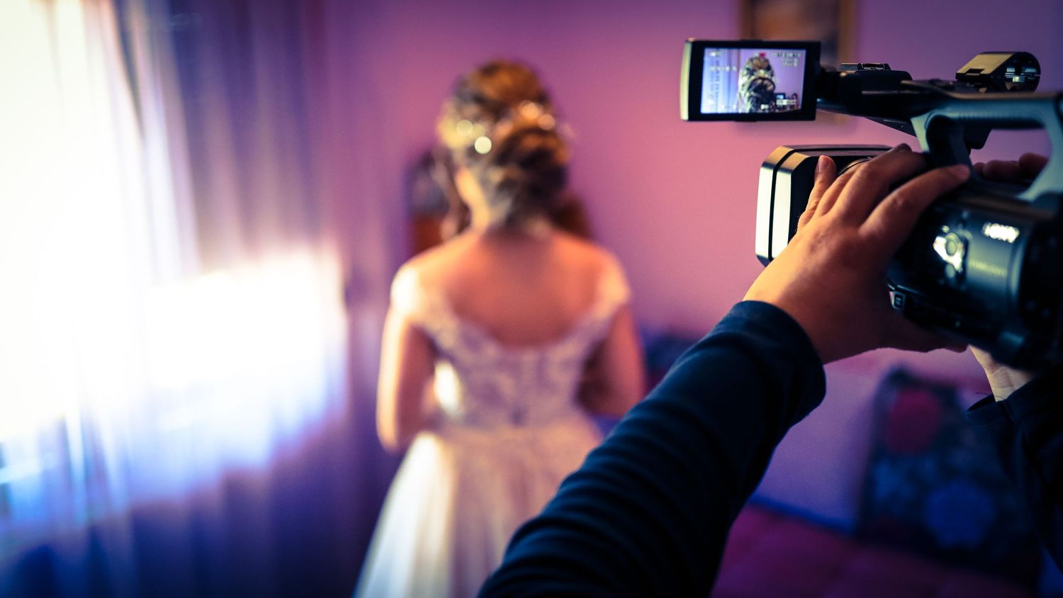 videographer films bride purple room