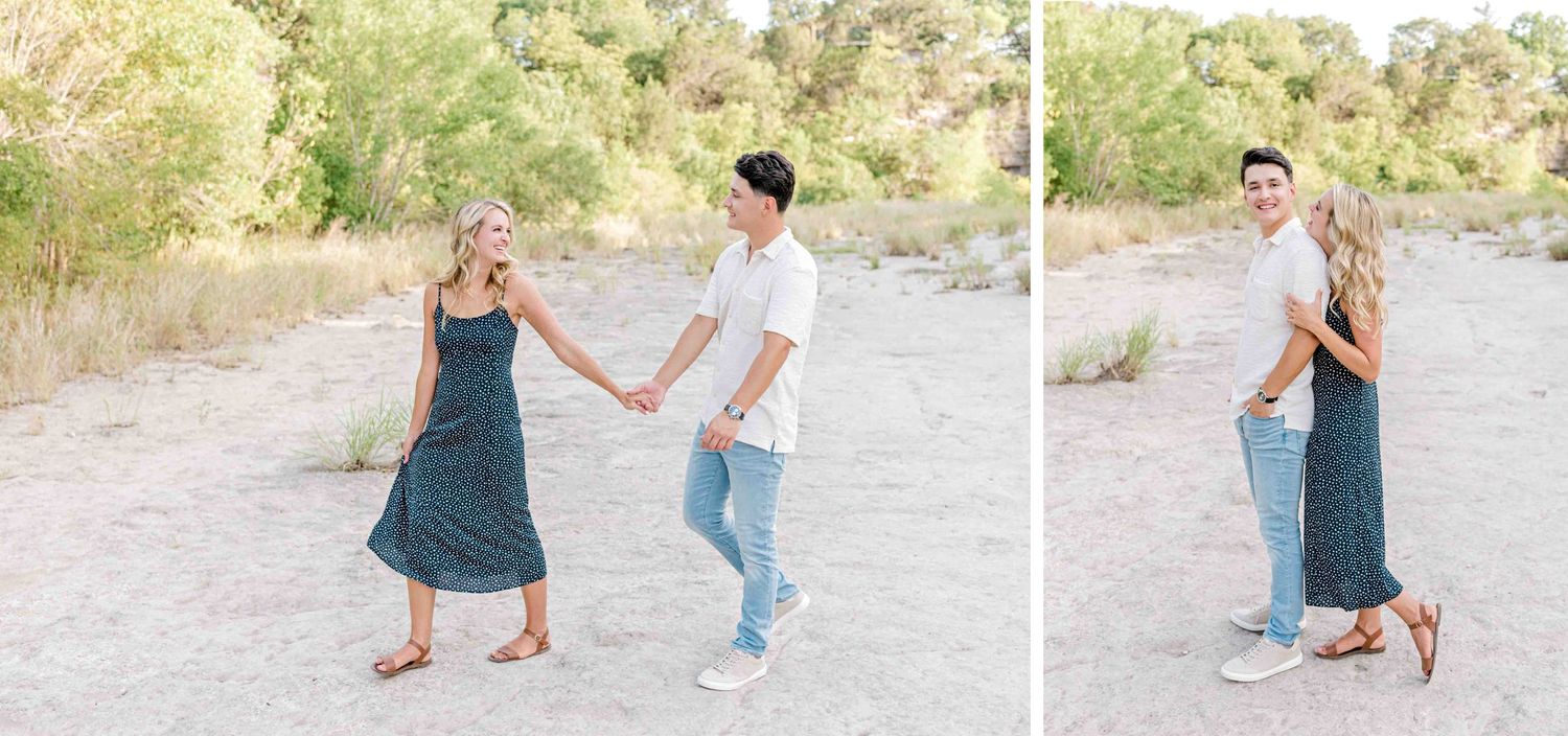 Sweet couple dancing and playing together on a dirt path outdoors.