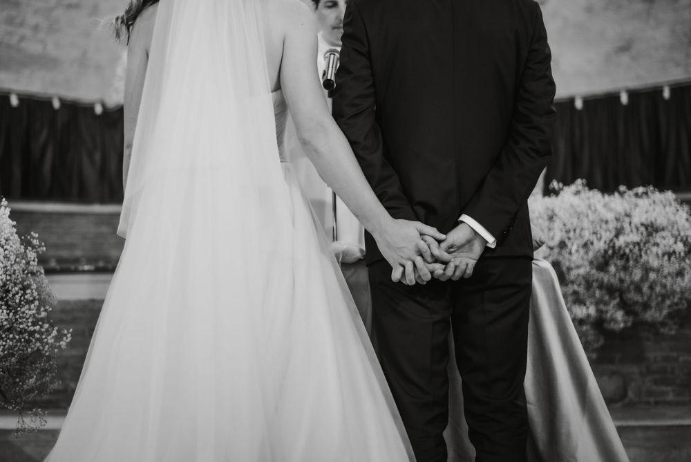Wedding ceremony moments captured in black and white photography.