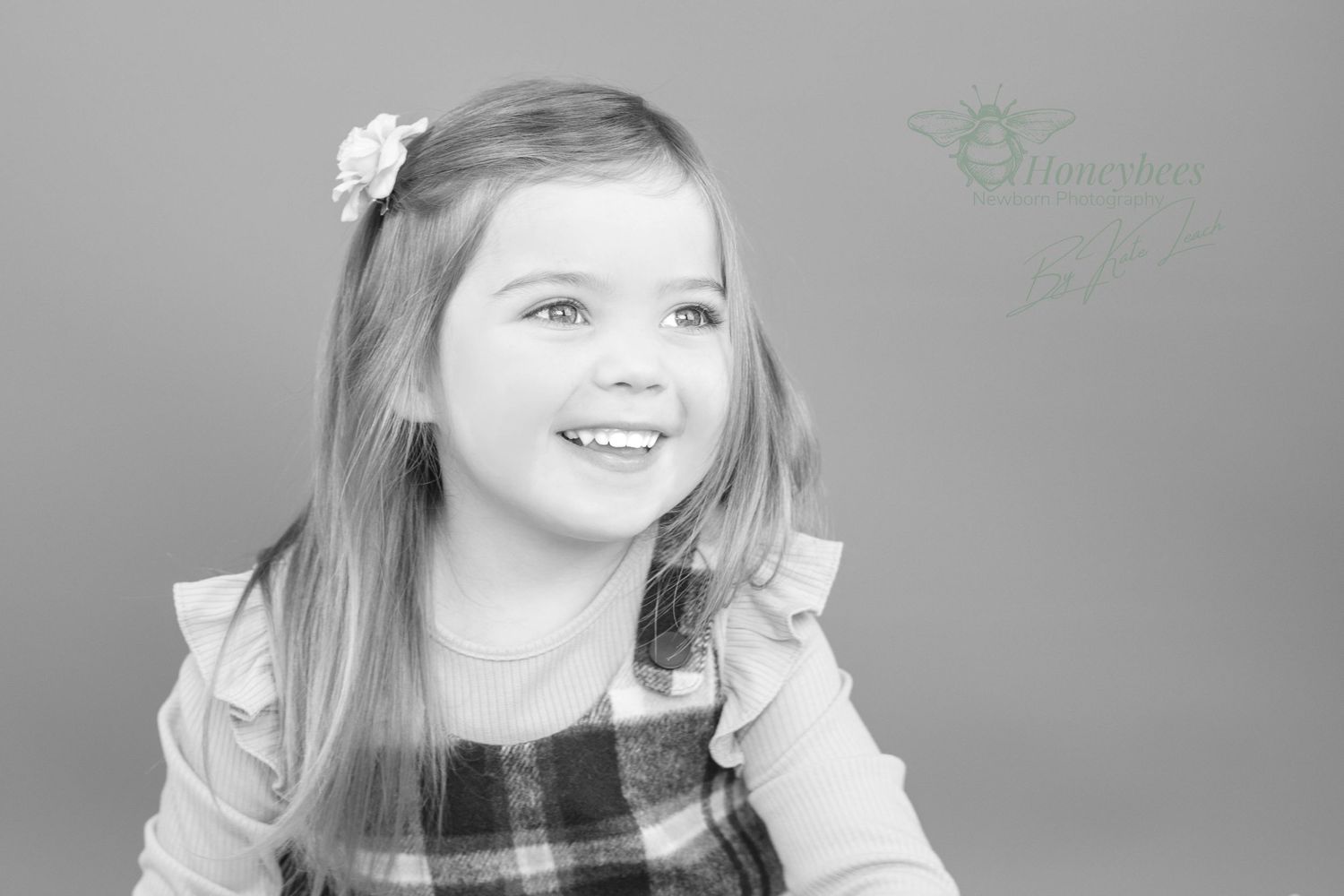 child photography shoot girl enjoying having her photo taken in back and white