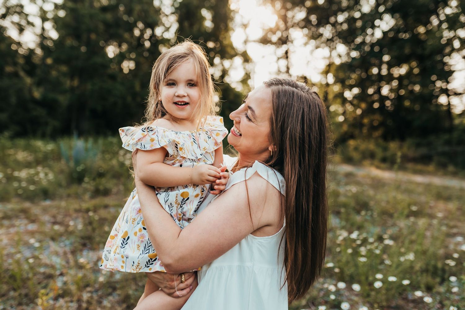 A candid outdoor moment captured during golden hour with natural expressions.