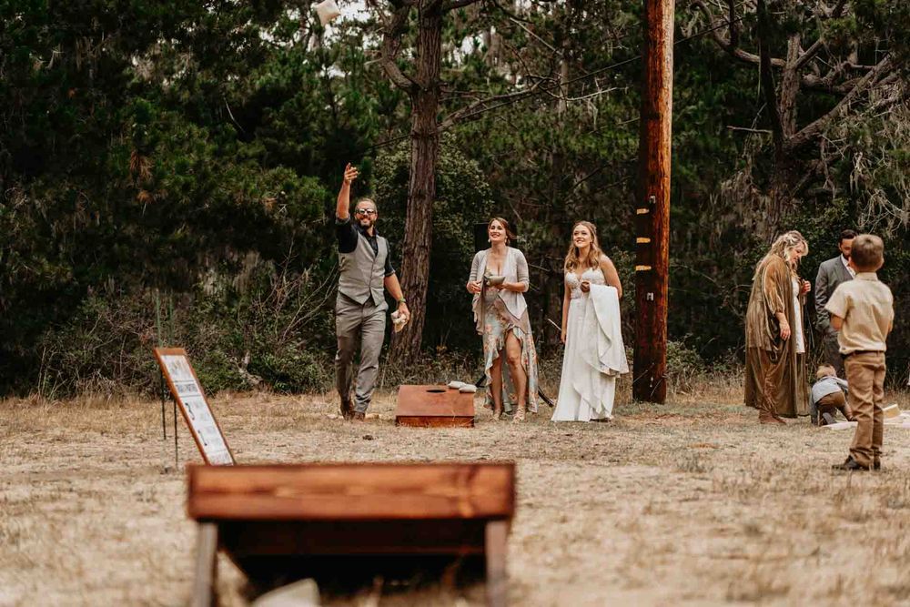 people playing cornhole