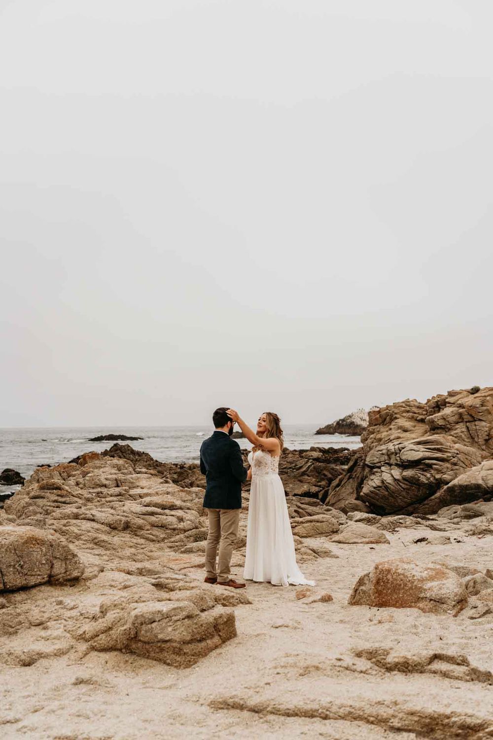 bride touches grooms head